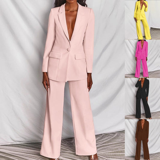 A woman wearing a professional 2-piece navy blue blazer and matching straight-leg pants set.